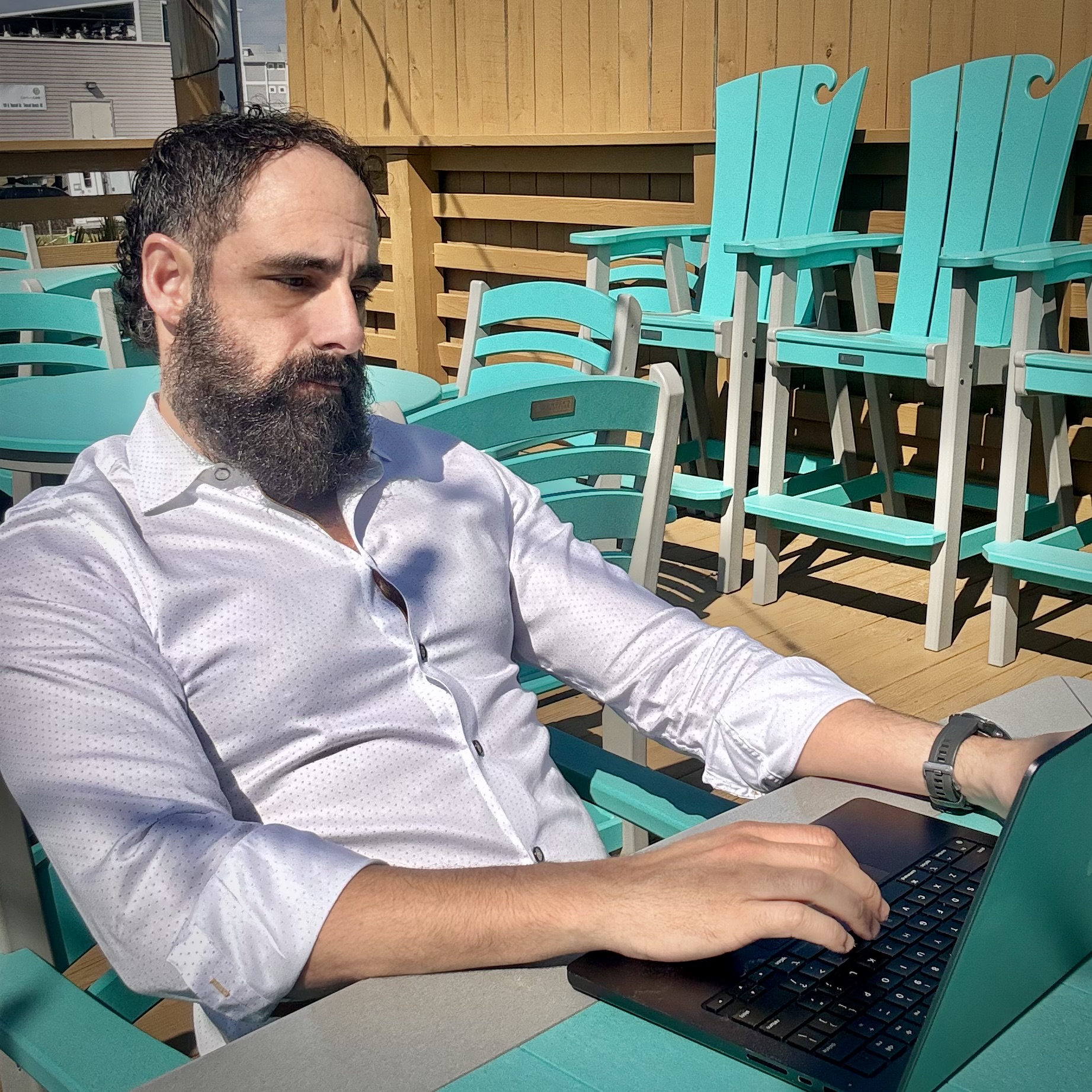 Andrew working at a laptop